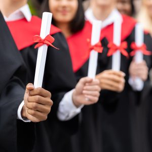 Graduators showing diplomas